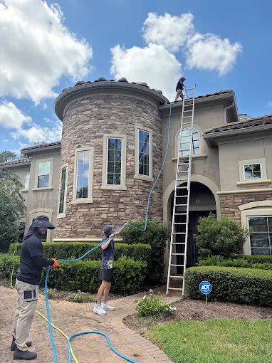 Bayway crew washing the exterior of a home