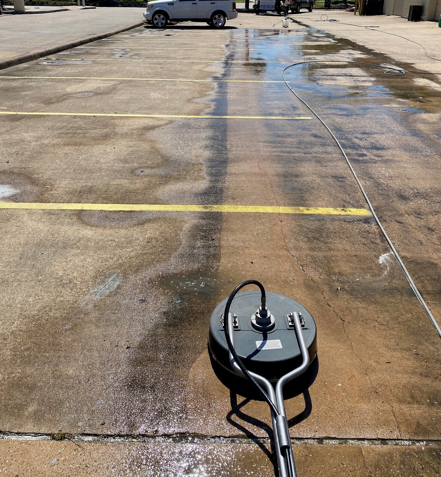 Our concrete surface-cleaning equipment in action.